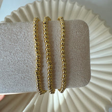 Load image into Gallery viewer, Triple Bead Gold Bracelet
